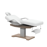 Table de massage électrique fixe blanche avec repose-tête ajustable et structure bois - Vue isométrique
