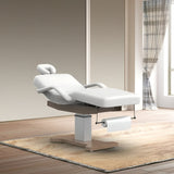 Table de massage électrique fixe blanche en environnement professionnel - Ambiance spa moderne avec rangement rouleau