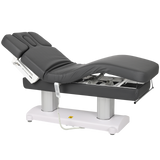 Tables de massage fixe gris foncé en position relevé et arrondi au niveau des jambes