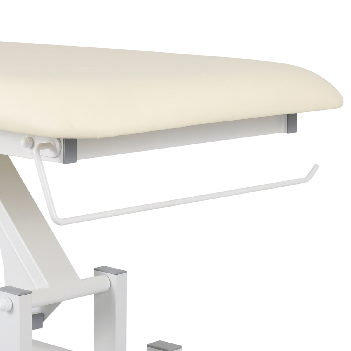 Détail du support porte-rouleau intégré pour table de massage couleur vanille - Barre blanche de fixation